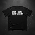 Black heavyweight tee with bold white BORN LOSING BUILT WINNING typography