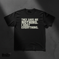 Black heavyweight tee with bold white THEY GAVE ME NOTHING I BUILT EVERYTHING typography