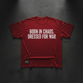 Red heavyweight tee with bold white BORN IN CHAOS DRESSED FOR WAR typography