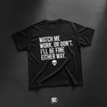 Black heavyweight tee with bold white WATCH ME WORK OR DON'T typography