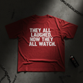 Red heavyweight tee with bold white typography - They All Laughed Now They All Watch