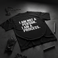 Black heavyweight tee with bold white I AM NOT A PERSON I AM A PROCESS typography