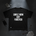 Black heavyweight tee with bold white SMILE NOW CRY FOREVER typography
